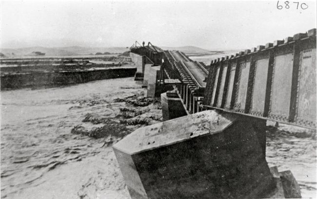 Railway line and bridge over Swakop River damaged by floods. Rails in water. Swakopmund 