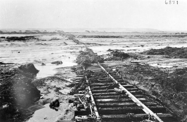 Railway line and bridge over Swakop River damaged by floods. Rails in water. Swakopmund 