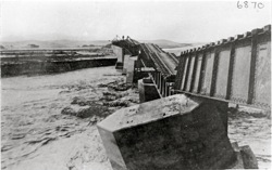 Railway line and bridge over Swakop River damaged by floods. Rails in water. Swakopmund 
