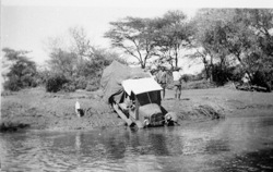 Cars stuck in river